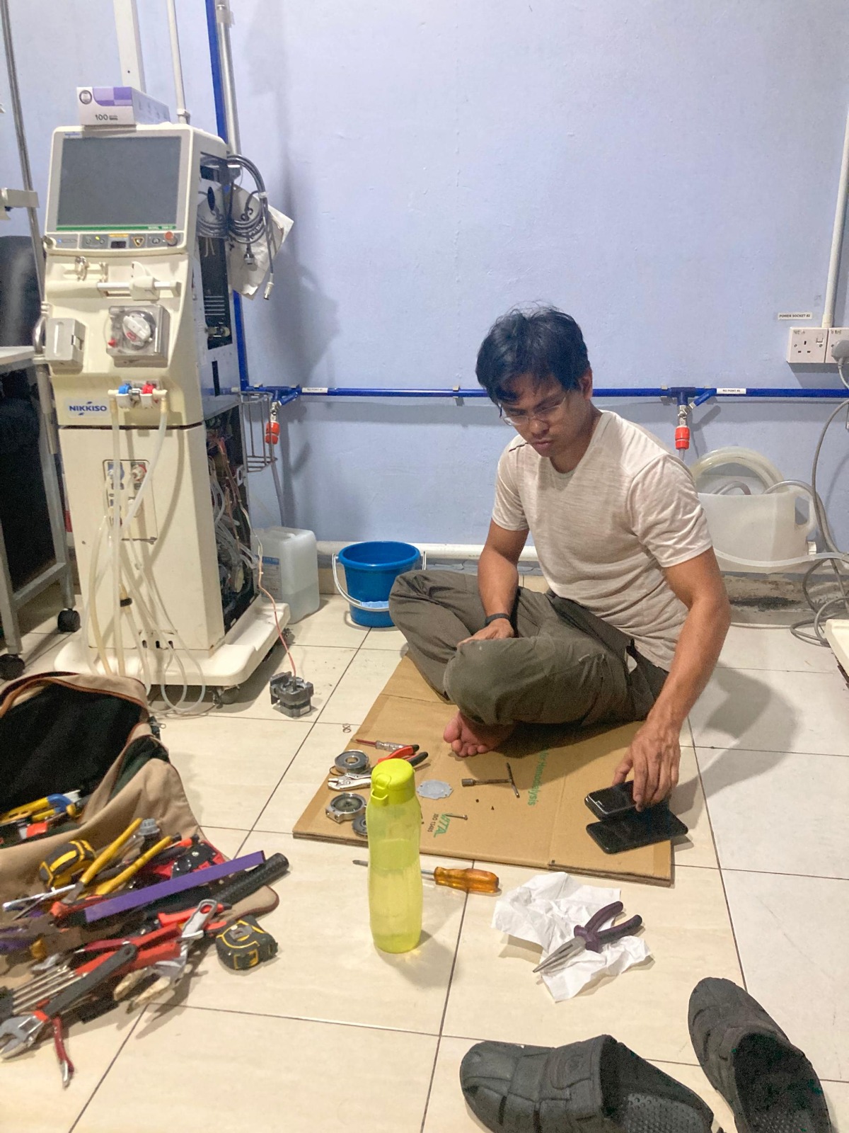 Dedicated technician ensuring the water system is in good condition at Pusat Hemodialisis Nur Ain